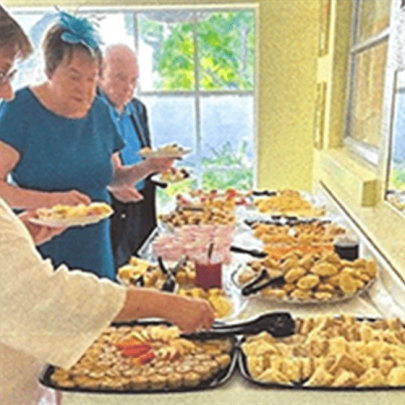 People standing in a buffet line