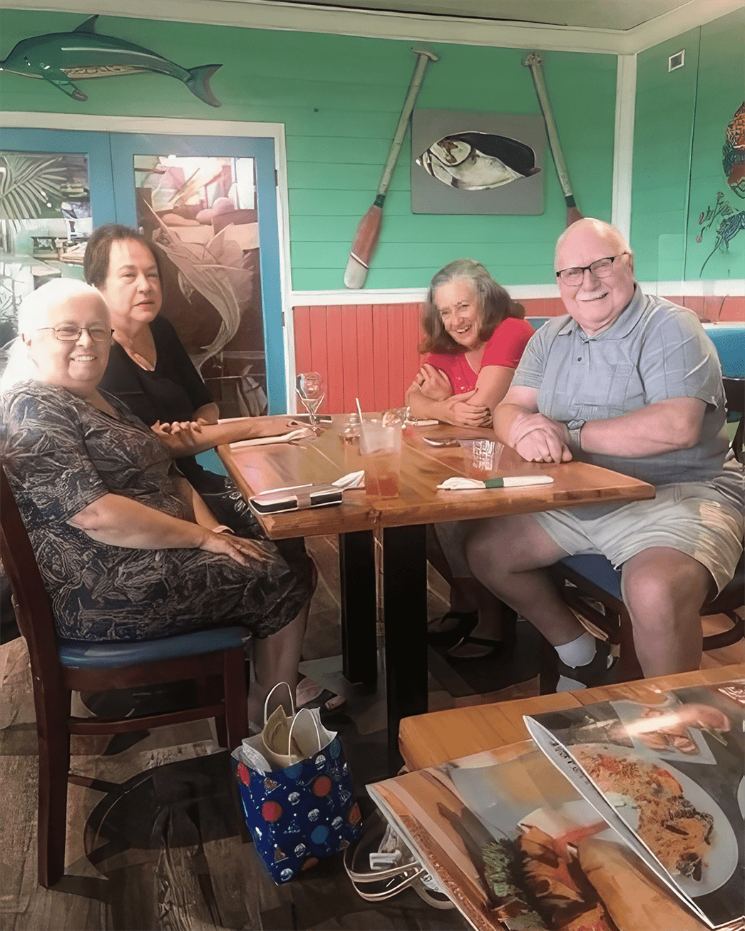 People seated at a table in a diner